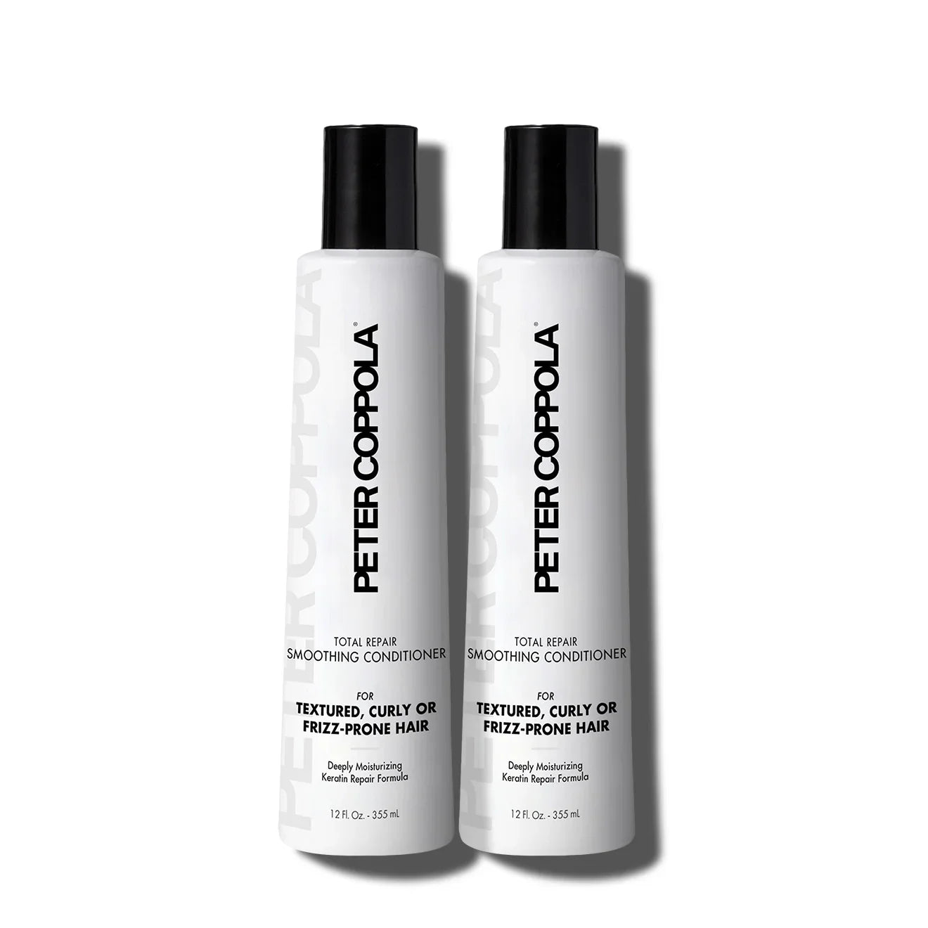 Two bottles of Peter Coppola Total Repair Smoothing Conditioner on a white background