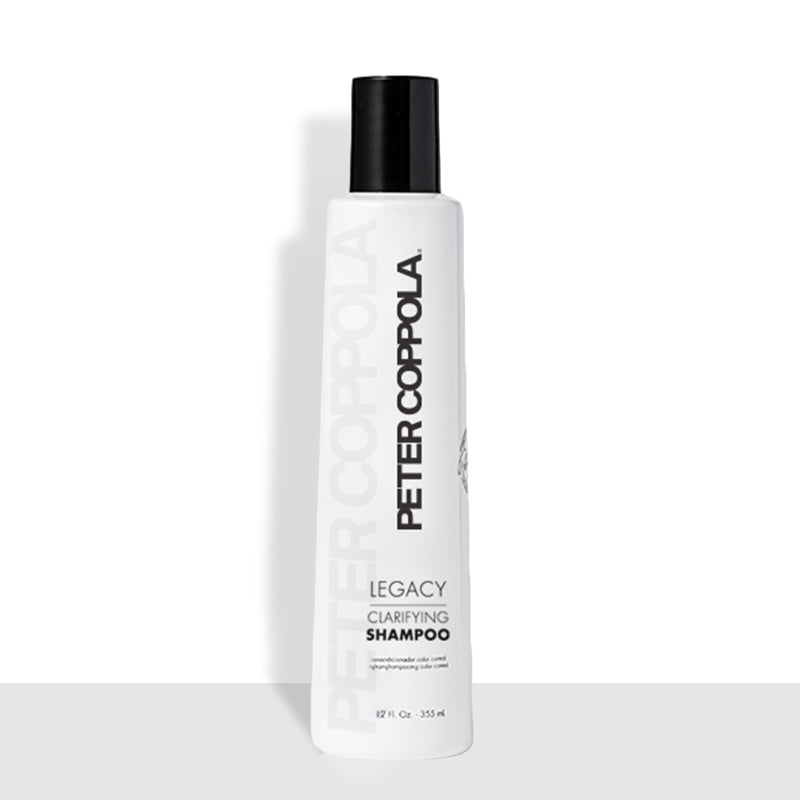White and gray bottle with a black cap. The text on the bottle is black and gray. 12 ounce bottle of legacy clarifying shampoo.