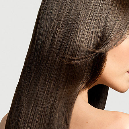 Closeup of brown, smooth, keratin treated hair