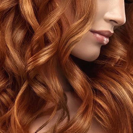 Closeup of colored, smooth, keratin treated hair