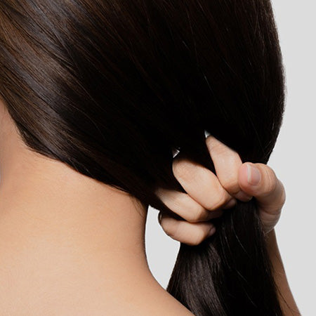 Closeup of dark brown, smooth, keratin treated hair