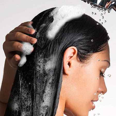 Closeup of shampoo in smooth, keratin treated hair