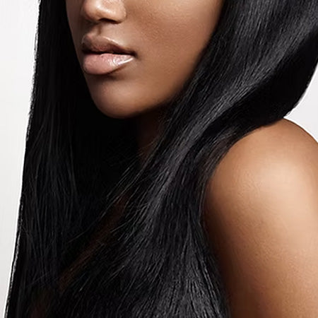 Closeup of dark, smooth, keratin treated hair