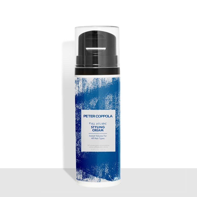 Airless bottle. This is blue and white with a black top and a clear protective lid. 4.4 ounce bottle of full volume styling cream.