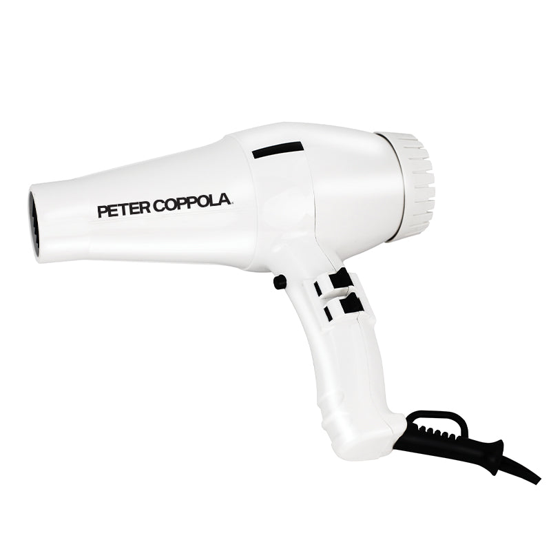White blowdryer with black Peter Coppola logo printed on it.
